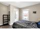 Comfortable bedroom with a large window and hardwood floors at 529 W 42Nd St, Indianapolis, IN 46208