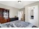 Relaxing bedroom with wood floors, ample storage with dressers, and ensuite bathroom at 529 W 42Nd St, Indianapolis, IN 46208