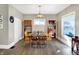 Well-lit dining room showcases a wood table with seating and convenient shelving at 529 W 42Nd St, Indianapolis, IN 46208