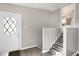 Bright entryway with a staircase leading to the upper level of the house at 529 W 42Nd St, Indianapolis, IN 46208