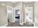 Hallway with views to bedroom, kitchen, and staircase at 529 W 42Nd St, Indianapolis, IN 46208