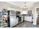 Modern kitchen with stainless steel appliances, white cabinets, and decorative tile backsplash at 529 W 42Nd St, Indianapolis, IN 46208