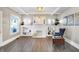 Inviting living room showcasing hardwood floors, a white brick fireplace with shelving, and stylish decor for a comfortable living at 529 W 42Nd St, Indianapolis, IN 46208