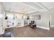Spacious living room featuring hardwood floors, a fireplace with built-in shelving, and elegant decor for a cozy atmosphere at 529 W 42Nd St, Indianapolis, IN 46208