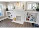 Bright living room featuring a fireplace with built-in shelves and modern flooring at 529 W 42Nd St, Indianapolis, IN 46208