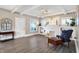 Spacious living room featuring stylish decor, hardwood floors, a brick fireplace, and built-in shelves for storage at 529 W 42Nd St, Indianapolis, IN 46208