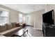 Comfortable living room features sectional couch, wood floors, and tv at 529 W 42Nd St, Indianapolis, IN 46208
