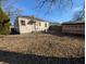 The backyard features an modest yard, a fence and a small storage shed at 603 W 33Rd St, Anderson, IN 46013