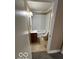 Bathroom featuring a toilet, shower and vanity at 603 W 33Rd St, Anderson, IN 46013