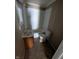 Functional bathroom with a shower-tub combo, window, and vanity at 603 W 33Rd St, Anderson, IN 46013