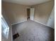 A bedroom featuring neutral walls and soft carpeting at 603 W 33Rd St, Anderson, IN 46013
