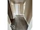 Hallway displaying neutral walls and carpet at 603 W 33Rd St, Anderson, IN 46013
