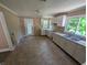 A simple kitchen with white cabinets and vinyl flooring at 603 W 33Rd St, Anderson, IN 46013
