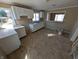 A view of the kitchen with white cabinets and a stainless steel sink at 603 W 33Rd St, Anderson, IN 46013