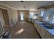 A view of the kitchen with white cabinets and a stainless steel sink at 603 W 33Rd St, Anderson, IN 46013