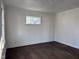 Bright bedroom showcasing freshly painted walls and finished hardwood flooring at 605 W 10Th St, Muncie, IN 47302