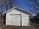 Detached garage with a classic white exterior, perfect for secure parking or extra storage at 605 W 10Th St, Muncie, IN 47302
