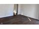 Bright living room with hardwood floors and white trim at 605 W 10Th St, Muncie, IN 47302