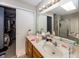 Bathroom with double sinks, vanity, and a combination shower and tub at 6116 Bartley Ct, Indianapolis, IN 46236