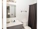 Well-lit bathroom featuring a modern sink and a shower with a dark curtain at 6116 Bartley Ct, Indianapolis, IN 46236