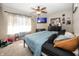 Inviting primary bedroom featuring soft lighting, comfortable bed and TV at 6116 Bartley Ct, Indianapolis, IN 46236