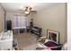 Bright bedroom with ceiling fan, window and neutral walls at 6116 Bartley Ct, Indianapolis, IN 46236