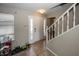 Bright entryway with tile flooring, a staircase, and a front door with sidelights at 6116 Bartley Ct, Indianapolis, IN 46236