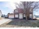 Two-story brick home with a well-maintained lawn and attached two-car garage at 6116 Bartley Ct, Indianapolis, IN 46236