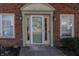 Close up of front door with decorative molding and matching sidelights at 6116 Bartley Ct, Indianapolis, IN 46236