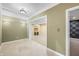 A large, open basement room with recessed lighting and doorway to finished room with carpet and sound-dampening panels at 685 Greystone Ct, Columbus, IN 47201