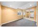 Finished basement featuring neutral walls and carpet, with recessed lights, a window, and decorative mirrors at 685 Greystone Ct, Columbus, IN 47201
