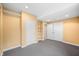 Finished basement showcasing storage options, neutral carpet, recessed lighting, and white paneled doors at 685 Greystone Ct, Columbus, IN 47201