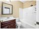 Bathroom featuring a vanity with dark wood cabinets, a toilet, and a shower-tub combo at 685 Greystone Ct, Columbus, IN 47201