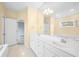 Bright bathroom features a soaking tub, double sink vanity, and large mirror at 685 Greystone Ct, Columbus, IN 47201