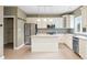 Bright kitchen with stainless steel appliances and a kitchen island with granite countertops at 685 Greystone Ct, Columbus, IN 47201