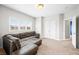 Neutral living room features a large couch and windows that provide lots of natural light at 685 Greystone Ct, Columbus, IN 47201