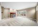 Spacious living room with fireplace and sliding doors leading to the deck at 685 Greystone Ct, Columbus, IN 47201