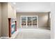 Inviting living room with a cozy fireplace and sliding glass doors to the backyard at 685 Greystone Ct, Columbus, IN 47201