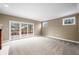 Spacious living room with sliding glass doors that open to the backyard and a decorative fireplace at 685 Greystone Ct, Columbus, IN 47201
