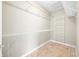 Organized walk-in closet with shelving and rod storage at 685 Greystone Ct, Columbus, IN 47201