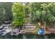 Aerial view of a lakefront property featuring terraced outdoor living spaces and private boat docks at 7082 Muskrat Dr, Nineveh, IN 46164