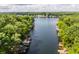 Breathtaking aerial view of the lake showcasing the calm water and lush green shoreline at 7082 Muskrat Dr, Nineveh, IN 46164