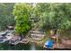 Aerial view of a lakefront property featuring terraced outdoor living spaces and private boat docks at 7082 Muskrat Dr, Nineveh, IN 46164