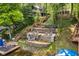 Aerial view of a lakefront property featuring terraced outdoor living spaces and private boat docks at 7082 Muskrat Dr, Nineveh, IN 46164