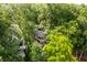 Aerial view of a multi-story home surrounded by mature trees at 7082 Muskrat Dr, Nineveh, IN 46164