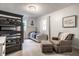 Charming bedroom with bunk beds, a twin bed, and a comfortable armchair with ottoman at 7082 Muskrat Dr, Nineveh, IN 46164
