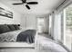 Light-filled bedroom with sliding glass doors and comfortable furnishings at 7082 Muskrat Dr, Nineveh, IN 46164