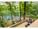 Multi-level deck offering lake views, lounge seating, and a grill area perfect for entertaining at 7082 Muskrat Dr, Nineveh, IN 46164