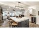 Open concept, white countertops, eat-in seating, flowing into the home's cozy living room at 7082 Muskrat Dr, Nineveh, IN 46164