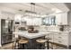 Open kitchen features a large island, stainless appliances, and lots of natural light at 7082 Muskrat Dr, Nineveh, IN 46164